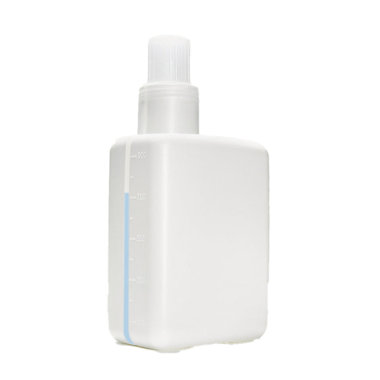Clear refill bottle for laundry detergent with measuring cap